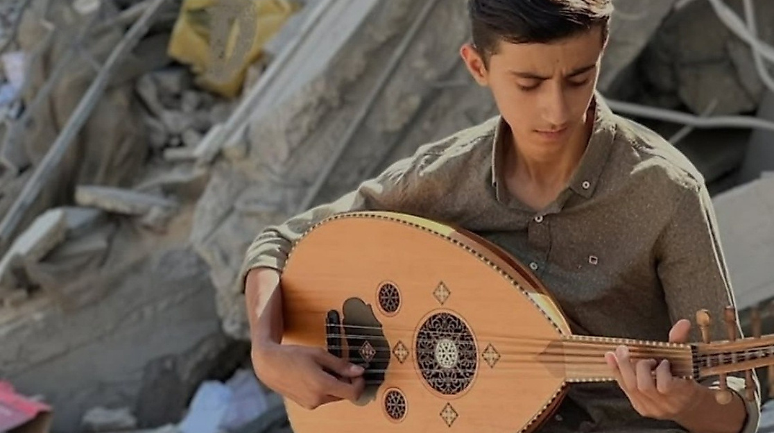 Samih Al-Madhoun finds hope in continuing to sing amid the rubble in Gaza.