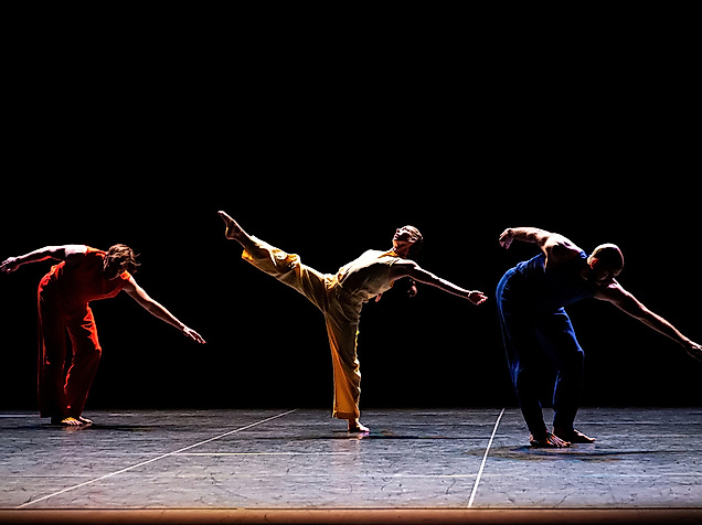 Performers Savannah Gaillard, Patrick Needham, Ashley Merker, Burr Johnson, Spencer Weidie, and Cecily Campbell dance virtuosically on stage, some jumping, others holding hands.