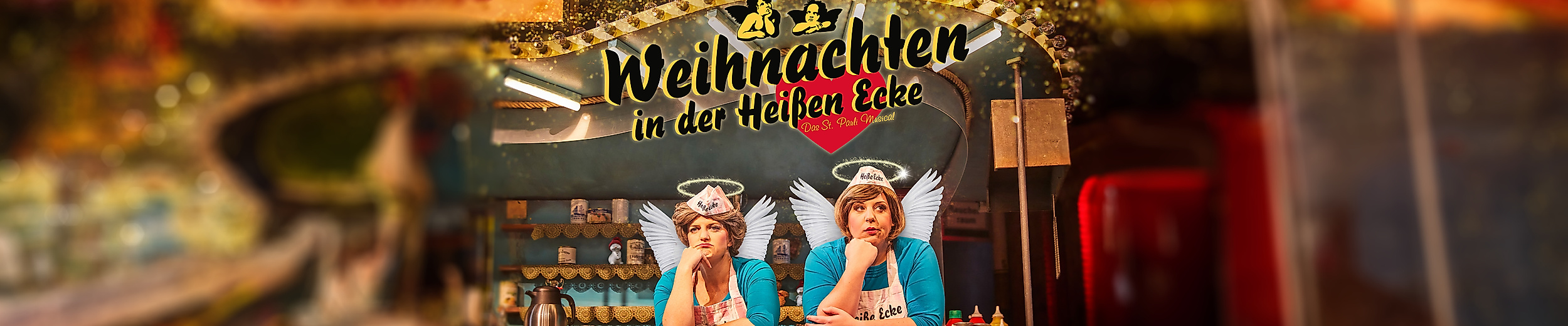 Weihnachten in der heißen Ecke: Zwei Frauen in Uniform hinter dem Tresen mit Engelsflügeln