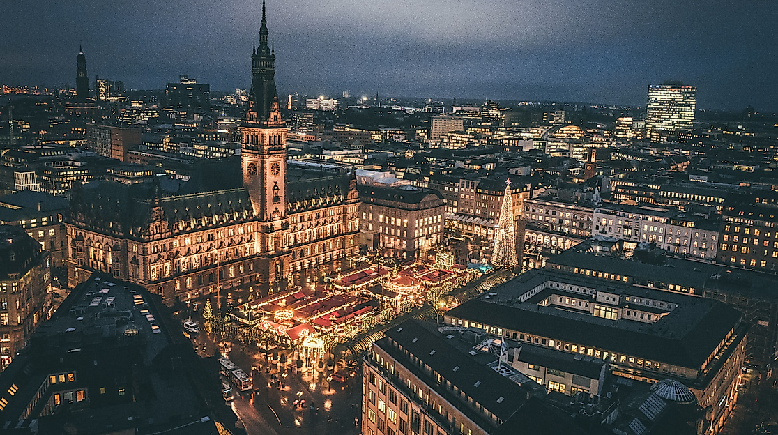 Aerial view of Hamburg’s city center with Christmas market lights and the illuminated Town Hall at night