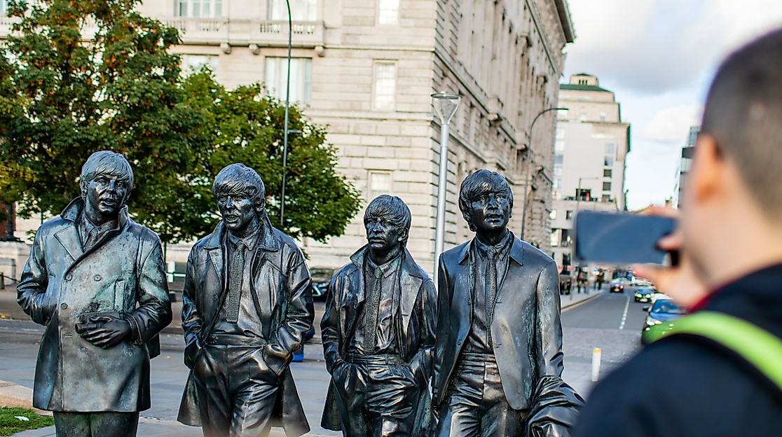 The Beatles statue with visitor (1)